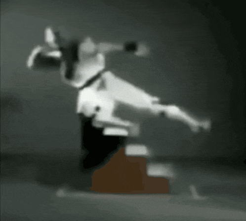 a blurred image of a person standing on a block