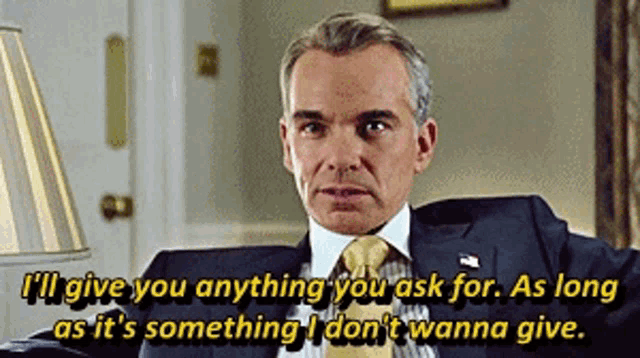 a man in a suit and tie is saying " i 'll give you anything you ask for