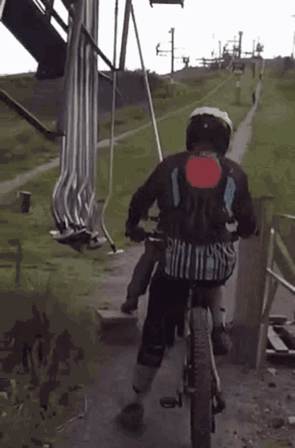 a person on a bike with the number 1 on the back