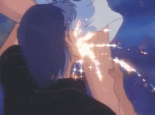 a person is holding another person 's arm with a glowing light coming out of it .