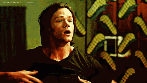 a man in a black shirt is standing in front of a wall with corn on it and the words deawasweepes tumblr at the bottom