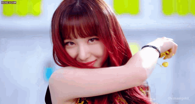 a close up of a woman with red hair and the words honeycam on the bottom right