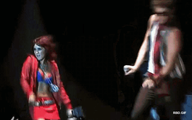 a man and a woman are dancing on a stage with rbd.gif written in the corner