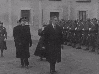 a black and white photo of a group of men in uniform