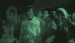 a group of young men are posing for a picture with one wearing a hoodie that says abercrombie and fitch