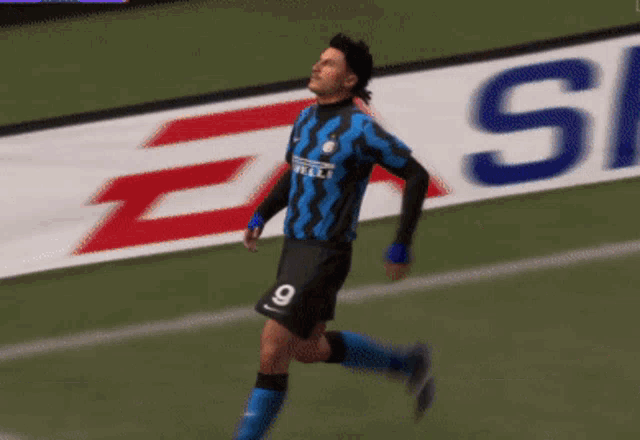 a soccer player in a blue and black jersey with the word irelli on the front