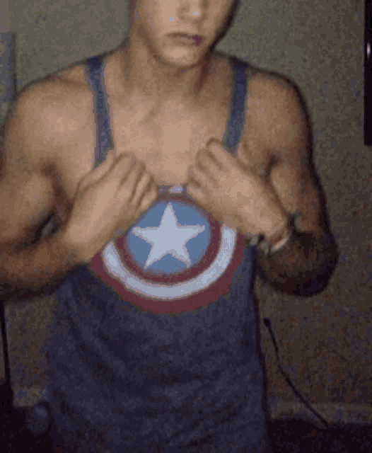 a man in a tank top with a captain america emblem on it
