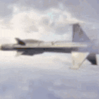 a fighter jet is flying through the clouds in the sky .