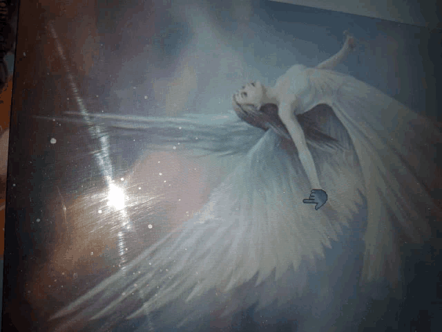 a painting of a woman with angel wings is laying down