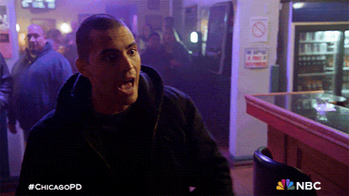a man is screaming in a bar with a nbc logo on the bottom