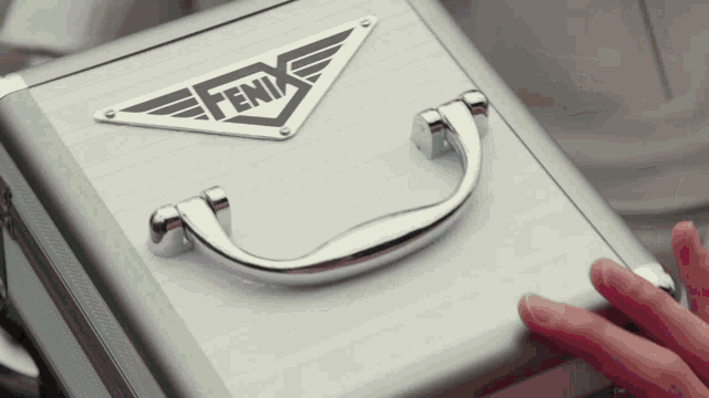 a silver fenix briefcase with a handle
