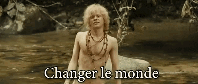 a shirtless man stands in a river with the words changer le monde written below him