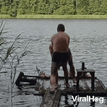Pushing Him Into The Water Viralhog GIF - Pushing Him Into The Water Viralhog Shoving Him Into The Water GIFs