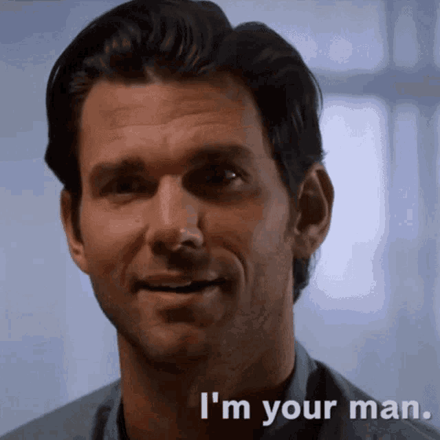 a man says " i 'm your man " while smiling