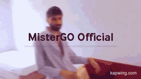 a blurred image of a man with the words mistergo official written above him
