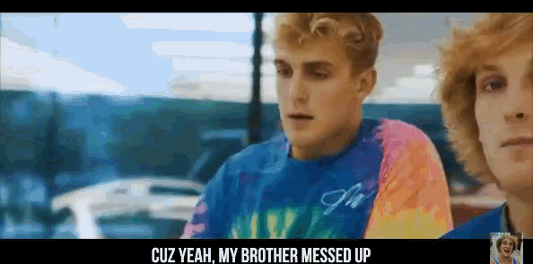 a man in a tie dye shirt is talking to another man