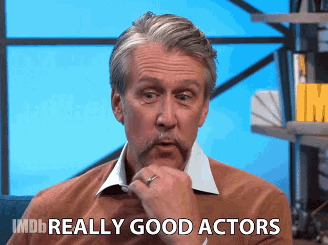 a man with a mustache and a ring on his finger says imdb really good actors
