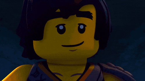 a close up of a lego figure with a smile