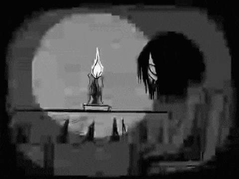 a black and white drawing of a person holding a candle .