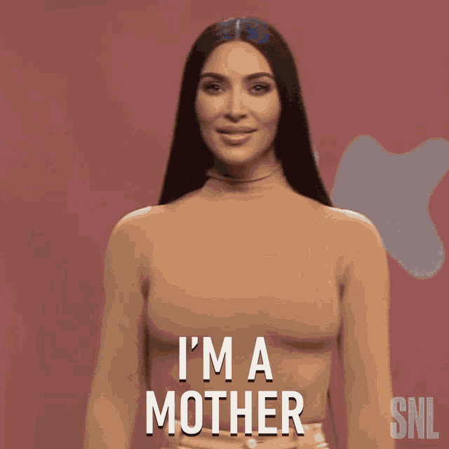 kim kardashian says i 'm a mother in front of a pink background