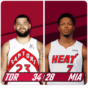 two basketball players one from the raptors and the other from the heat pose for a picture