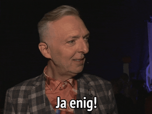 a man in a plaid jacket says " ja enig "