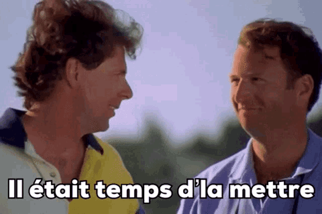 two men are talking to each other with the words il était temps d ' la mettre on the bottom .