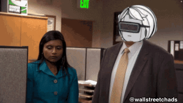 a man in a suit and tie is standing next to a woman in a blue suit