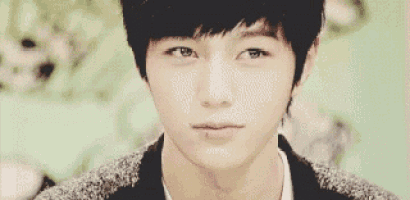 a close up of a young man looking at the camera .