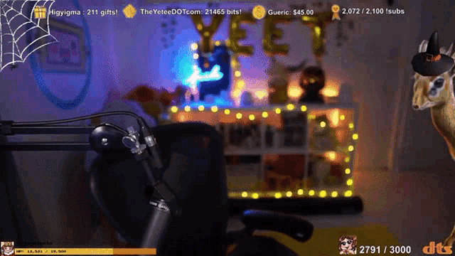 a giraffe is sitting in front of a microphone with a spider web in the background
