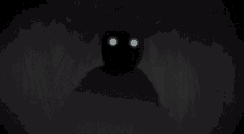 a shadow of a monster with horns and glowing eyes is behind a curtain .