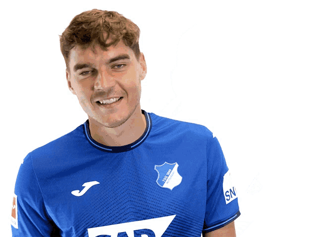 a man wearing a blue shirt that says tsg 1899