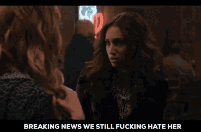 a woman talking to another woman with the words breaking news we still fucking hate her on the bottom