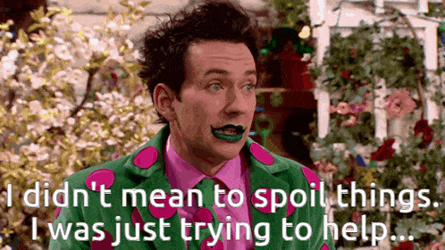 a man in a green and pink polka dot suit is talking about spoiling things