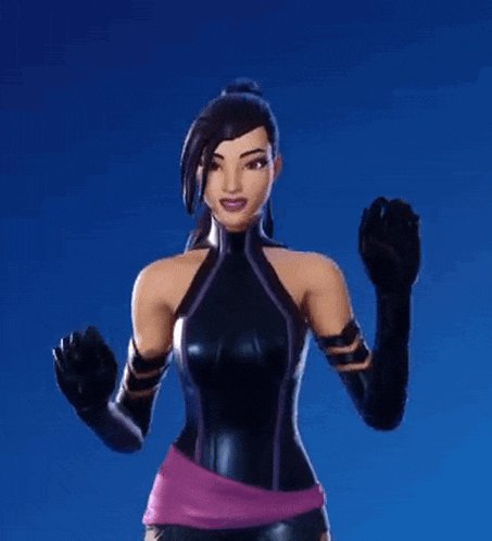 a woman in a black jumpsuit and gloves is standing with her arms in the air .