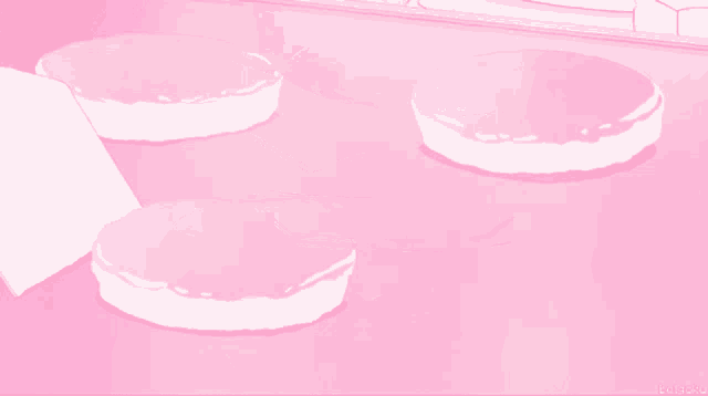 three pink cakes are on a pink surface with the letters ln on the bottom right