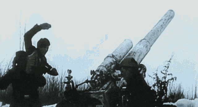 a man in a gas mask stands in front of a helicopter