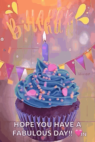 a birthday cupcake with blue frosting and a lit candle
