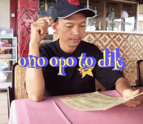 a man sitting at a table with the words " ono opo to dik " written above him