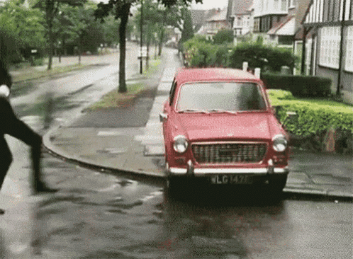 a red car with a license plate that says wlg1429