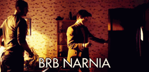 two men are standing in a dark room with the words brb narnia