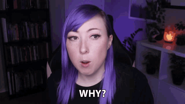 a woman with purple hair says " why " in front of a bookshelf