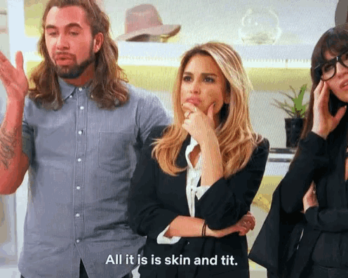 a woman says all it is skin and tit while standing next to a man