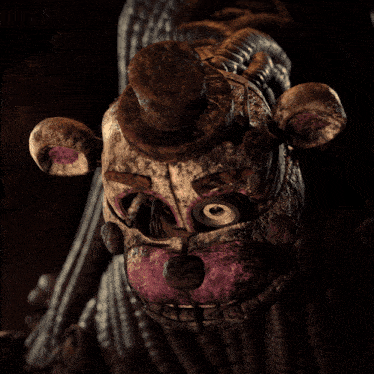 a statue of a teddy bear with a top hat on it