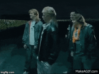 a group of people are dancing and pointing at the camera with the words hooooomoooo on the bottom right