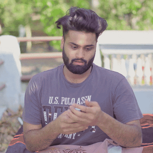 a man with a beard wearing a us polo assn shirt