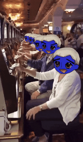 a group of people are playing a slot machine with blue faces on their faces