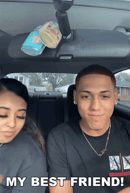 a man and a woman in a car with the words my best friend