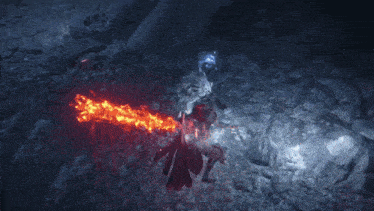 a person holding a sword with a red flame coming out of it