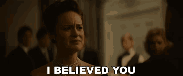 a woman says i believed you in a crowded room